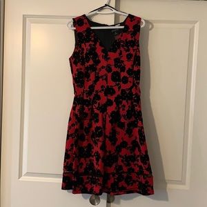 Sleeveless red with black velvet overlay dress